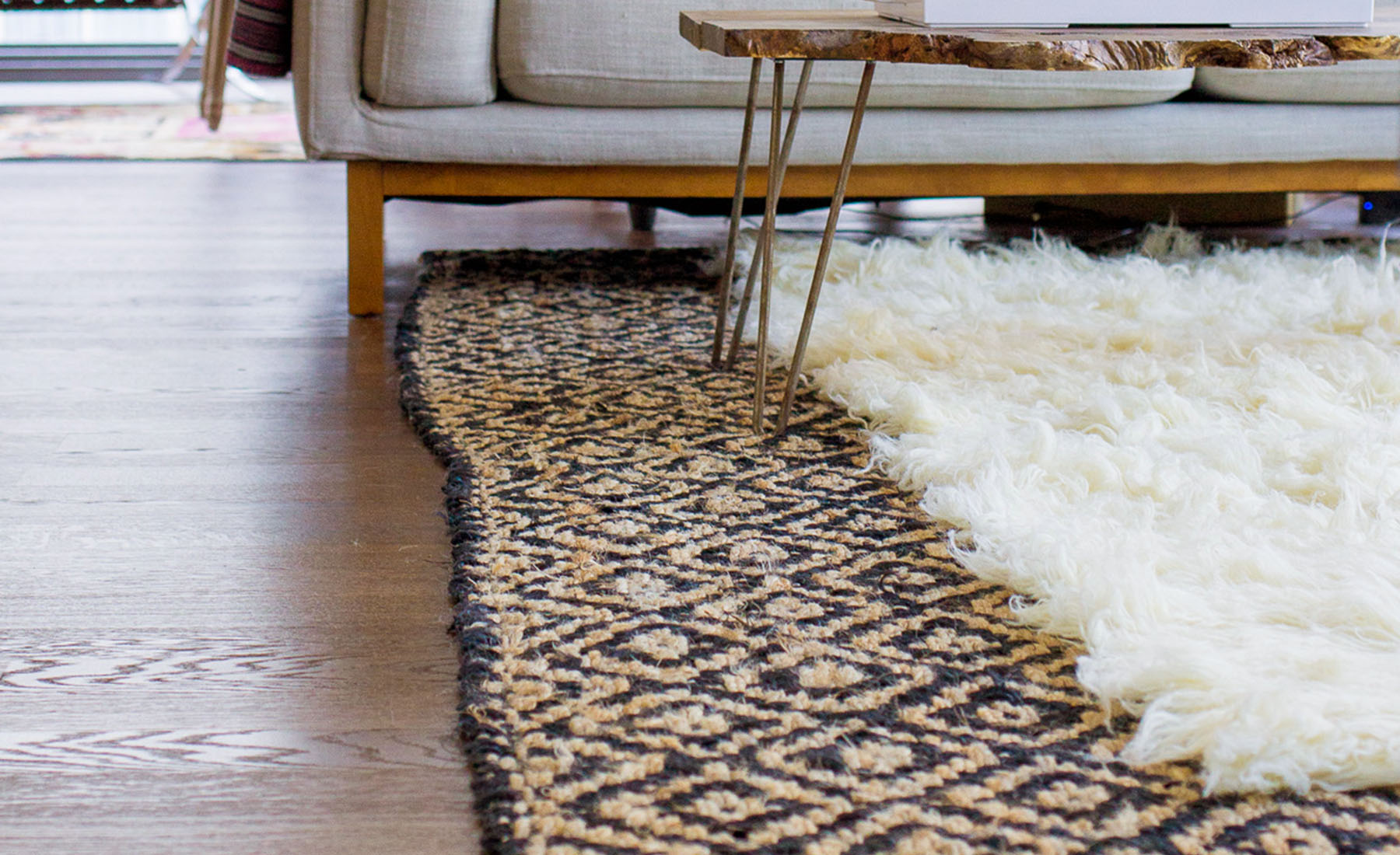 Consider Patterns: Experiment with patterns by layering a plain rug with a patterned rug. You can opt for a more tonal look by layering a cream Berber-style rug on top of a sisal or jute rug.
